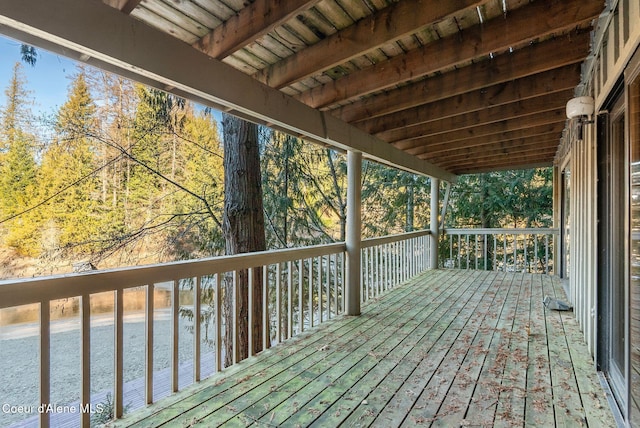 wooden deck featuring a water view