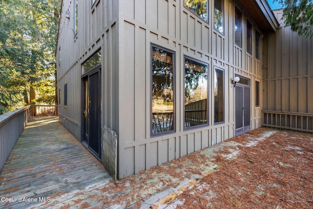 view of property exterior featuring a deck and board and batten siding