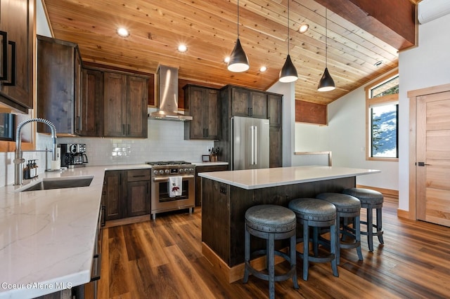 kitchen with premium appliances, a wall unit AC, wood ceiling, a sink, and exhaust hood