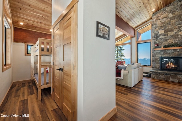 hall featuring wood ceiling, high vaulted ceiling, wood finished floors, and beamed ceiling