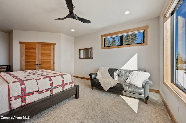 carpeted bedroom featuring ceiling fan, baseboards, and recessed lighting