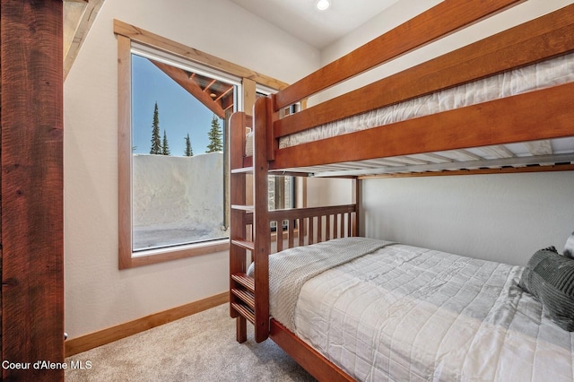 bedroom featuring carpet floors and baseboards