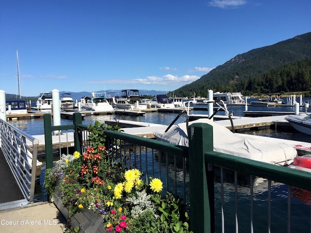 dock area featuring a water and mountain view