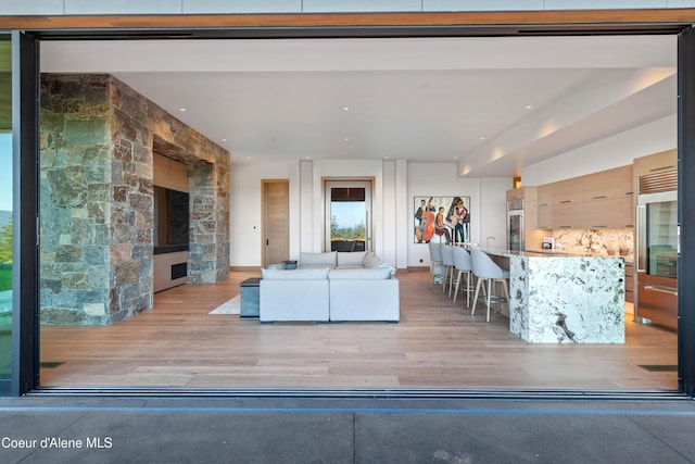 unfurnished living room with light wood-type flooring and recessed lighting