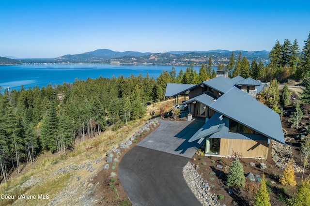 aerial view featuring a water and mountain view