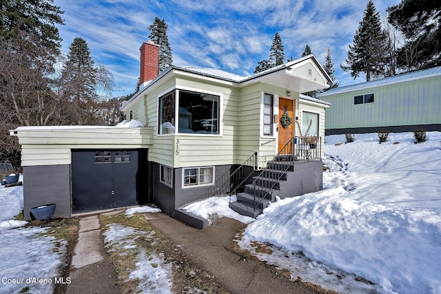 315 Montana St, Mullan, ID 83846 - view of front facade with metal roof and a chimney