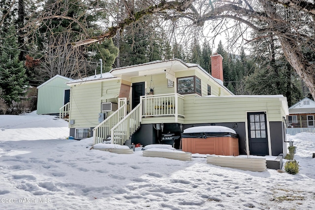 315 Montana St, Mullan, ID 83846 - view of front of home featuring stairway, a chimney, and a hot tub
