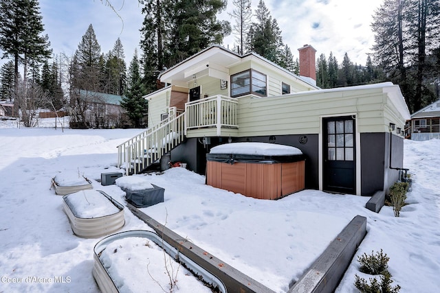 315 Montana St, Mullan, ID 83846 - view of front facade with a garage, stairway, and a hot tub