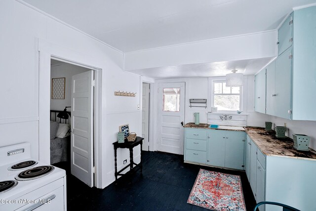 315 Montana St, Mullan, ID 83846 - kitchen featuring electric range and blue cabinetry