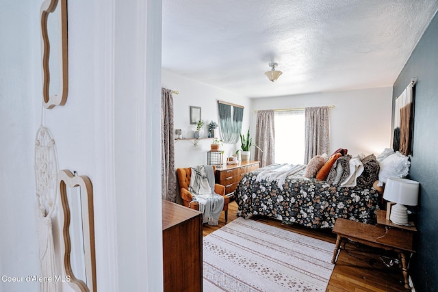 315 Montana St, Mullan, ID 83846 - bedroom with a textured ceiling and wood finished floors