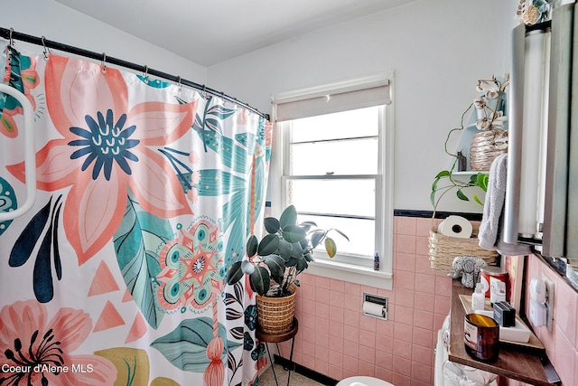 315 Montana St, Mullan, ID 83846 - full bath featuring curtained shower, a wainscoted wall, and tile walls
