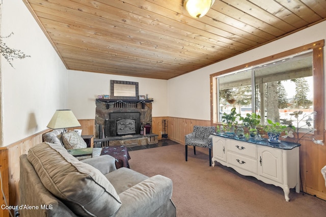 carpeted living area featuring a wainscoted wall, wood ceiling, and wooden walls