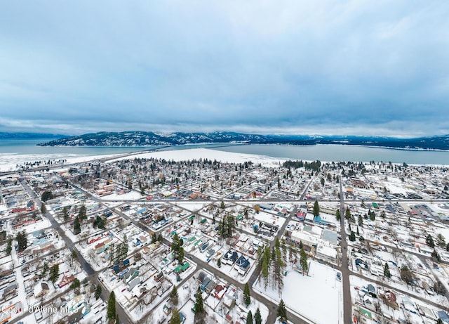 bird's eye view featuring a view of city and a water and mountain view