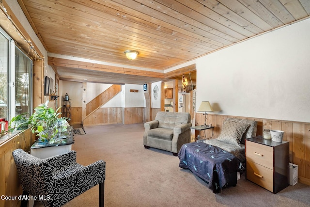 interior space with a wainscoted wall, wood walls, and wood ceiling