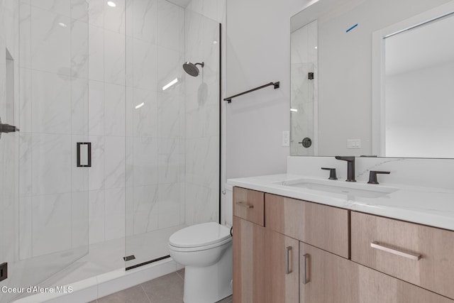 bathroom featuring toilet, a stall shower, tile patterned flooring, and vanity