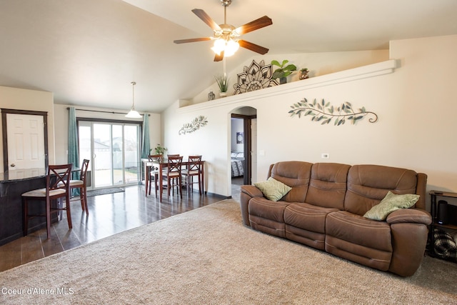 living area featuring arched walkways, high vaulted ceiling, ceiling fan, wood finished floors, and carpet flooring