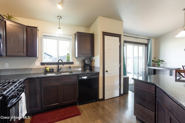 kitchen featuring dark wood-style flooring, dark brown cabinetry, a sink, and black appliances