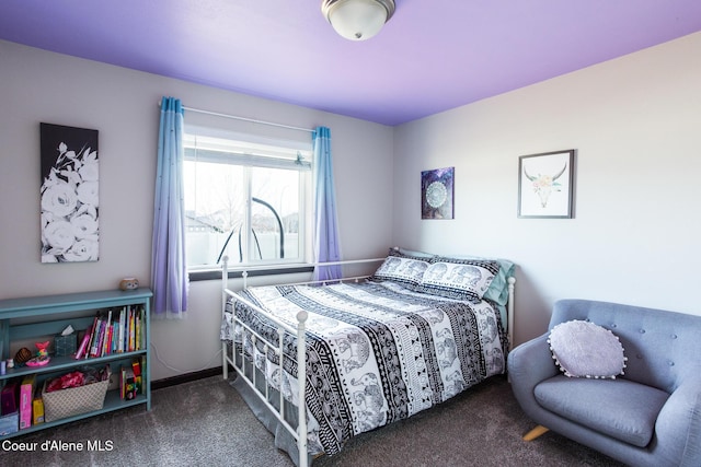 bedroom featuring carpet flooring and baseboards