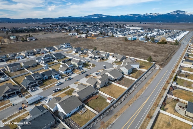 drone / aerial view featuring a residential view and a mountain view