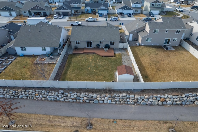 birds eye view of property with a residential view