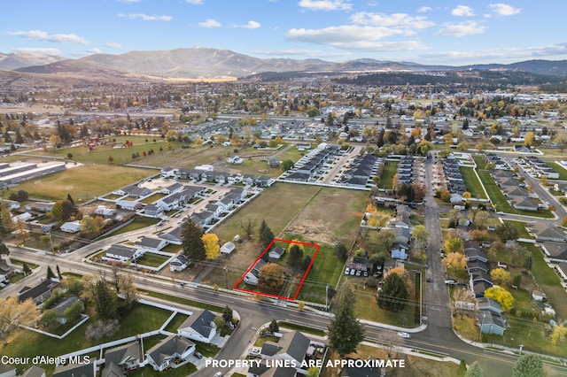 birds eye view of property featuring a mountain view