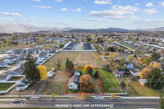 aerial view featuring a mountain view and a residential view