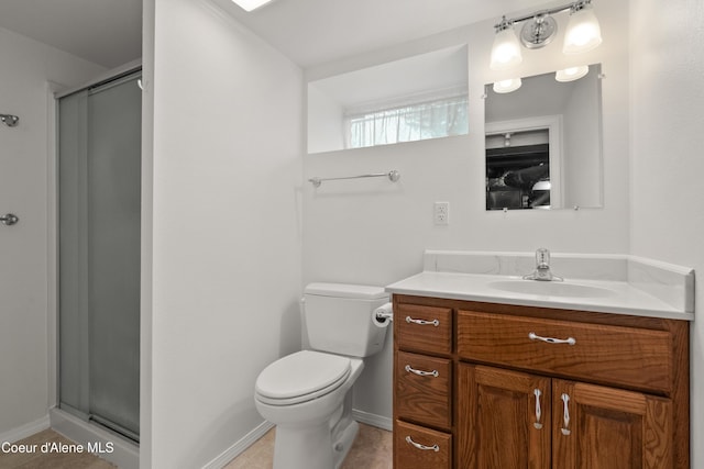 full bath with a stall shower, toilet, vanity, and baseboards