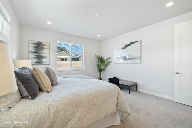 carpeted bedroom featuring recessed lighting and baseboards