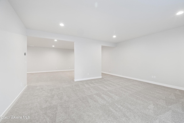 finished basement with carpet, baseboards, and recessed lighting