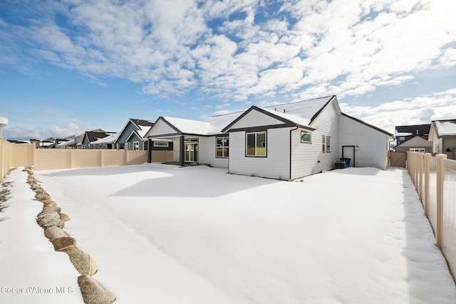 exterior space with a fenced backyard and a residential view