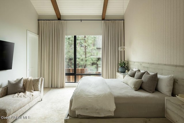 bedroom featuring lofted ceiling with beams, wallpapered walls, and light colored carpet