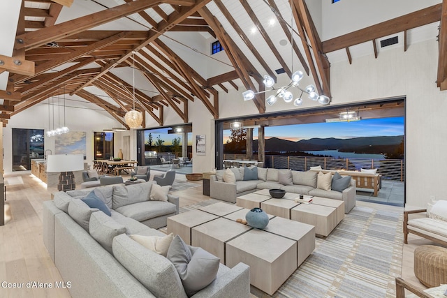 6895 S Gozzer Rd Unit A201, Harrison, ID 83833 - view of patio featuring an outdoor living space, outdoor dining space, and a mountain view