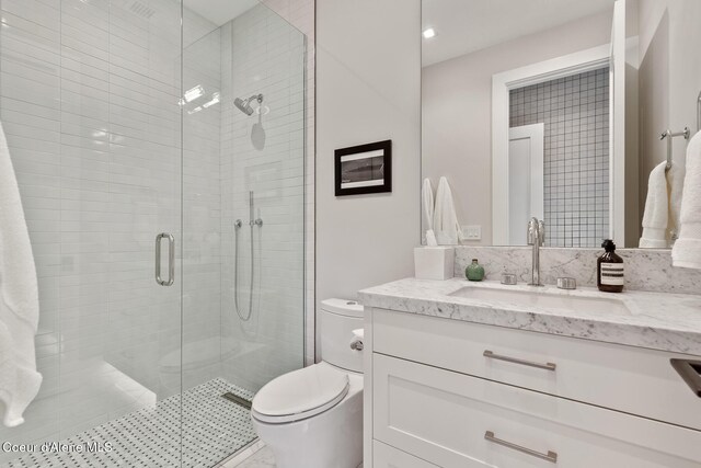 6895 S Gozzer Rd Unit A201, Harrison, ID 83833 - full bathroom with toilet, vanity, and a stall shower