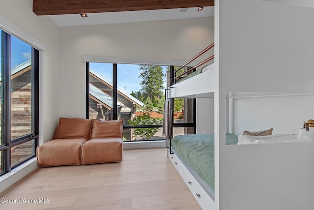 6895 S Gozzer Rd Unit A201, Harrison, ID 83833 - bedroom featuring multiple windows, light wood-style floors, and wood ceiling