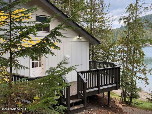 view of side of property with a wooden deck