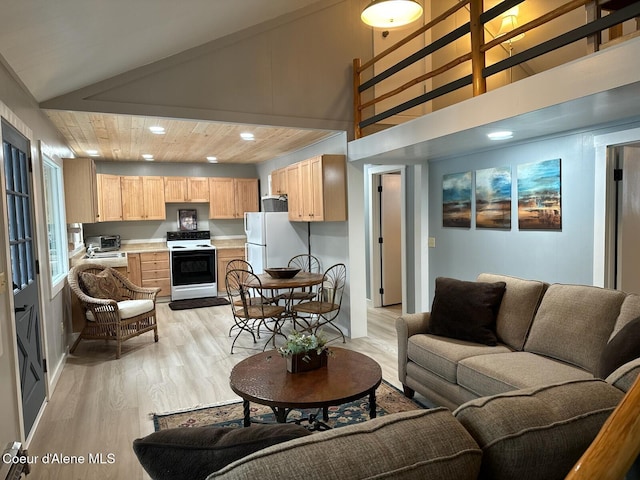 living room with high vaulted ceiling, recessed lighting, light wood-type flooring, and a toaster