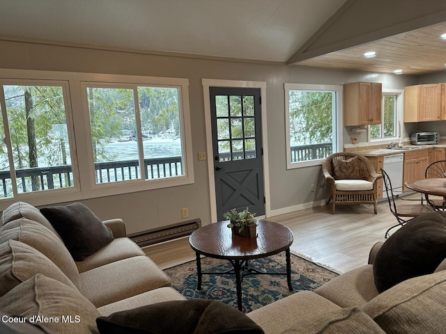 living room featuring a toaster, baseboards, light wood-style flooring, vaulted ceiling, and recessed lighting