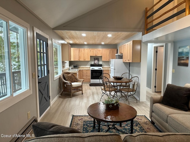 living area with light wood-style floors, lofted ceiling, baseboards, and recessed lighting