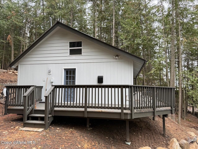 back of property featuring a wooden deck