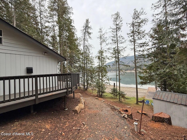 view of yard with a deck with mountain view