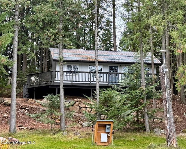 rear view of property with a deck