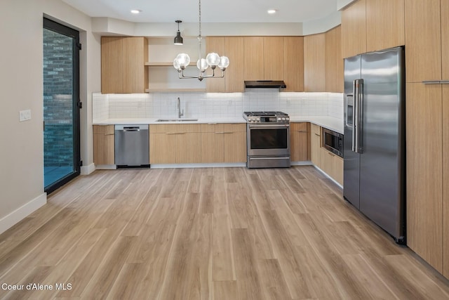 kitchen with light brown cabinets, under cabinet range hood, stainless steel appliances, light countertops, and open shelves