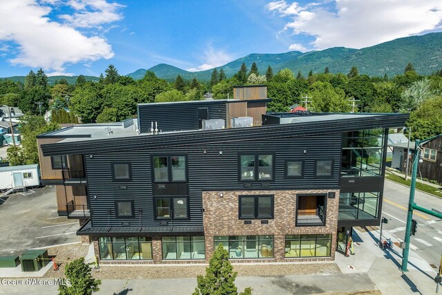 back of property featuring a mountain view