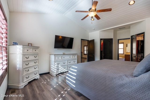 bedroom with vaulted ceiling, dark wood-style floors, visible vents, and a ceiling fan