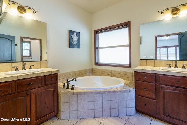 bathroom featuring two vanities, tile patterned flooring, and a sink