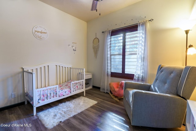 bedroom featuring baseboards and wood finished floors