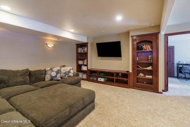 carpeted living area featuring recessed lighting