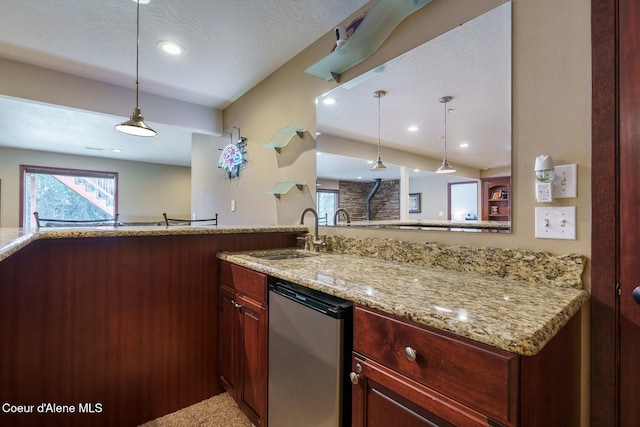 kitchen featuring reddish brown cabinets, dishwasher, light stone counters, decorative light fixtures, and a sink