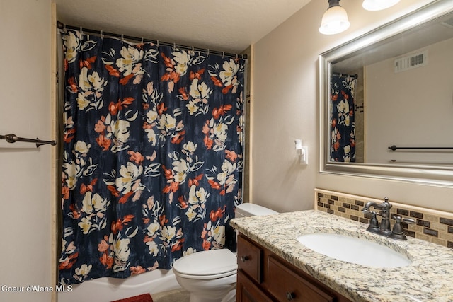 bathroom featuring toilet, tasteful backsplash, vanity, and visible vents