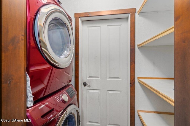 laundry room featuring laundry area and stacked washer / dryer